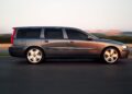 A grey Volvo V60 Cross Country wagon is driving on a road with a blurred background, capturing the motion and spirit of the wagon era as final U.S. orders approach.