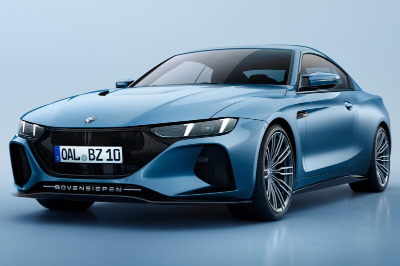 A blue sports coupe with sleek lines and large alloy wheels is displayed in a studio setting, capturing the analog spirit celebrated by 20 Cars That Focused on Analog Engagement in 2025, with a front license plate reading "OAL BZ 10.