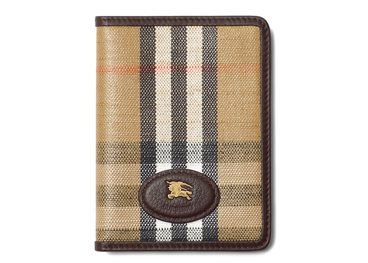 A plaid-patterned wallet with brown leather trim and an embossed oval logo patch featuring an animal and "BURBERRY" on the front—an ideal addition to any Holiday Gift Guide or duPont REGISTRY wish list for 2026.