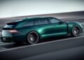 A sleek, green Wingback Wagon drives on a smooth, multi-lane road, viewed from the rear side, showcasing its aerodynamic design and tinted windows.
