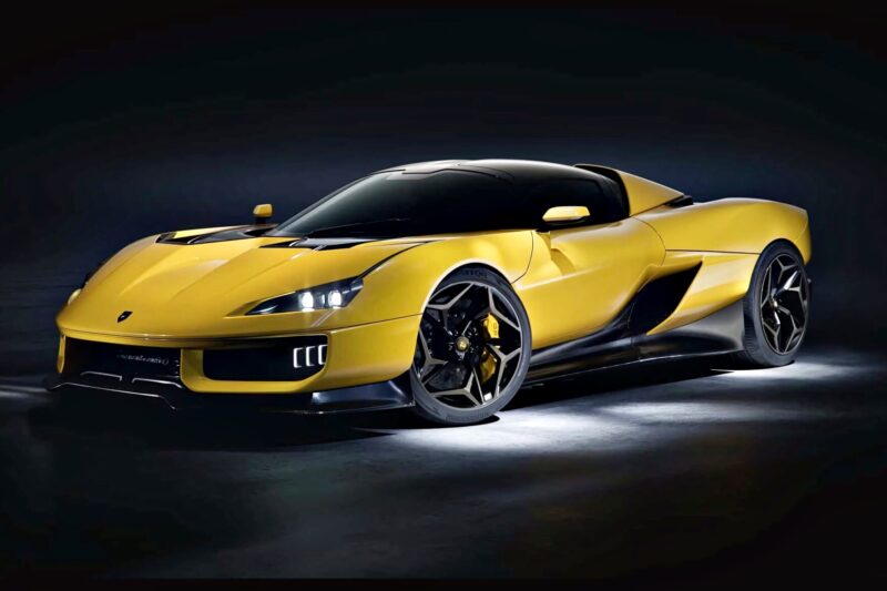 A yellow sports car with black accents is parked in a dark studio, illuminated by overhead lighting—one of the 20 Cars That Focused on Analog Engagement in 2025.