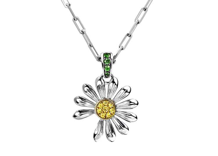 Featured in the duPont REGISTRY 2026 Holiday Gift Guide, this silver necklace boasts a daisy-shaped pendant with a yellow center and sparkling green gemstones on the bail.