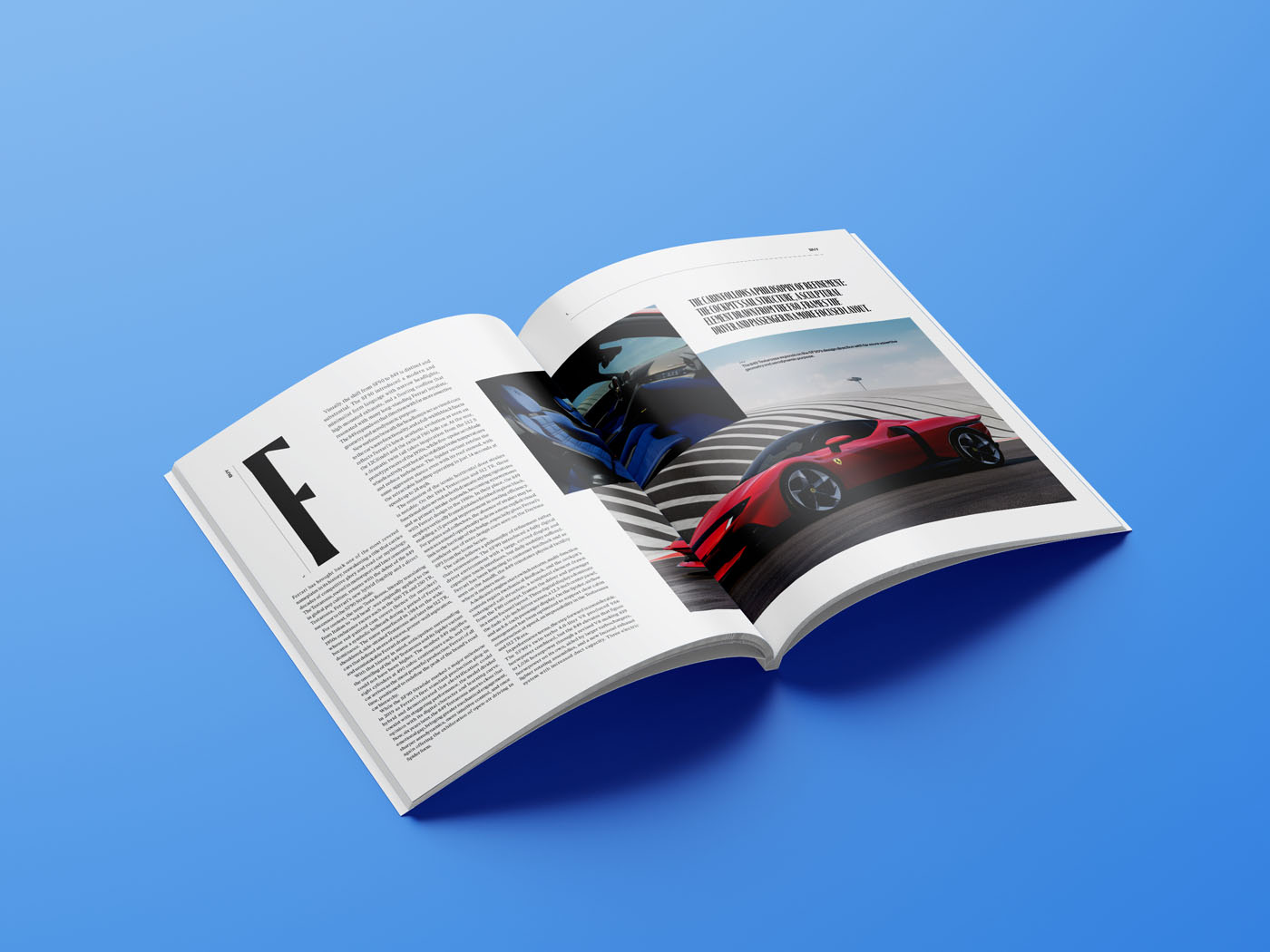 An open duPont REGISTRY magazine on a blue surface displays a January 2026 article with text on the left page and images of sports cars on the right page.