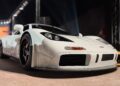 A white sports car with black wheels displayed indoors under bright lights, photographed from a low front angle—Feature Exclusive: $25.3M McLaren F1 leads RM Sotheby's Abu Dhabi Auction.