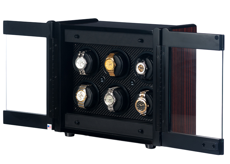 A black watch winder box with transparent doors displays six wristwatches, each secured in individual holders inside the case—a perfect pick for the 2026 duPont REGISTRY Holiday Gift Guide.