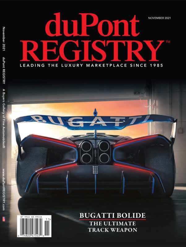 Rear view of a Bugatti Bolide supercar parked in a garage, featured as one of the Cover Cars on the November 2021 duPont REGISTRY magazine for its 40th Anniversary issue.