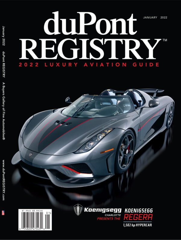 Cover Cars: duPont REGISTRY’s 40th Anniversary issue showcases a silver Koenigsegg Regera hypercar with red accents, promoting the 2022 Luxury Aviation Guide.
