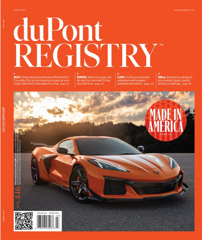 An orange 2023 Chevrolet Corvette Z06 is parked on pavement, featured as one of the Cover Cars for the duPont REGISTRY's July 2022 issue with the headline "Made in America.