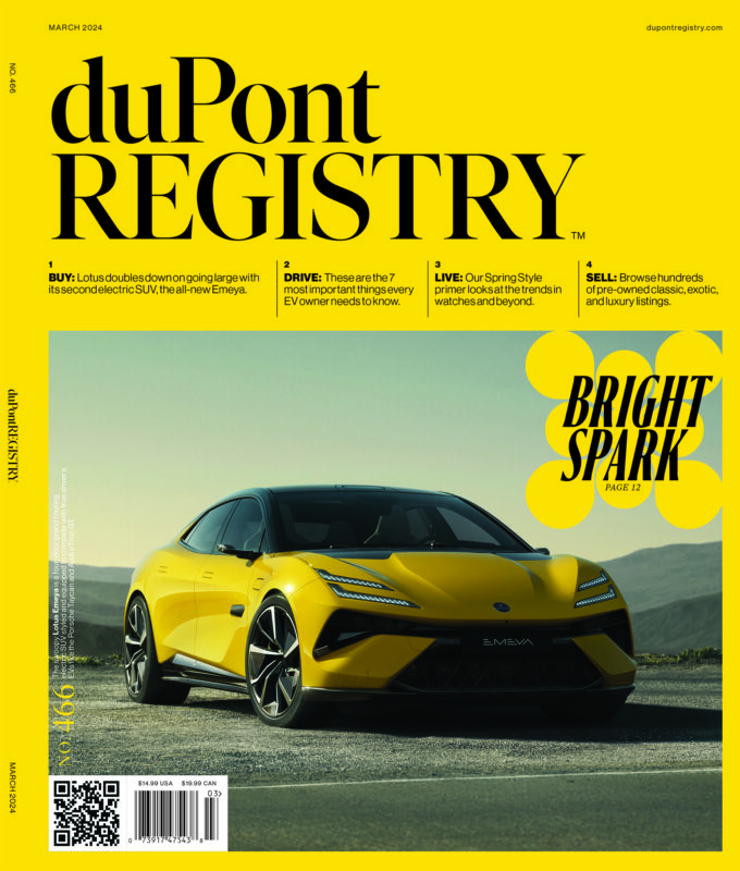 Yellow Lotus Emeya electric SUV parked on asphalt under a blue sky, featured as a Cover Car for the 40th Anniversary March 2024 issue of duPont REGISTRY with headlines about buying, driving, and selling autos.