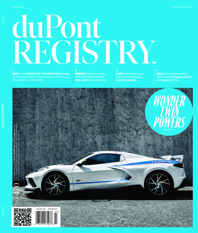 White YENKO/SC® Corvette sports car parked beside a textured gray wall, featured as one of the Cover Cars for duPont REGISTRY's 40th Anniversary edition, July 2024 issue.