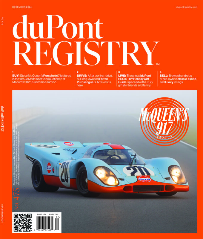 A vintage Gulf-liveried Porsche 917 race car with number 21 drives on a racetrack; celebrated as one of the iconic Cover Cars on the orange December 2024 duPont REGISTRY magazine for its 40th Anniversary.