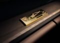 A gold plaque on a wooden surface displays the Porsche logo, a signature, and the text “Dr. Ing. h.c. F. Porsche,” commemorating the 90th Birthday of F. A. Porsche, with “ONE OF 250” engraved on the right side.