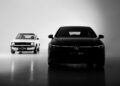 A black and white photo shows the original hot hatch, a classic Volkswagen Golf GTI, on the left and a modern Volkswagen GTI on the right, both facing forward in a studio setting.